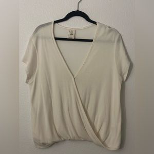 Cream wrap top blouse. In very good condition.